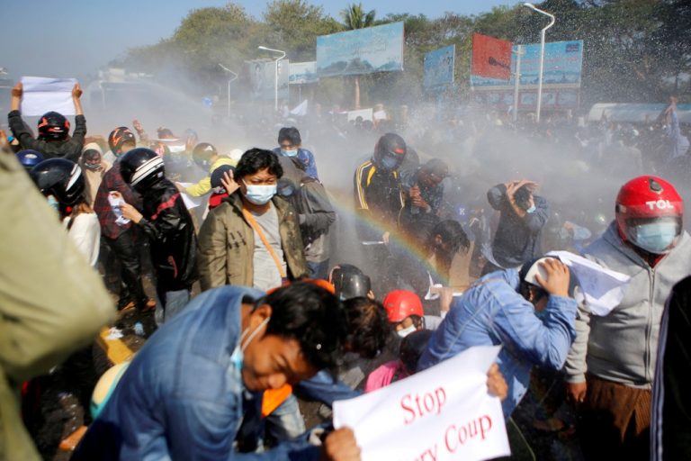 Myanmar police fire into air to disperse protests, four hurt