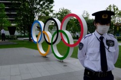 Japan to extend virus emergency until month before Olympics