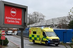 As virus surges, England builds temporary hospitals