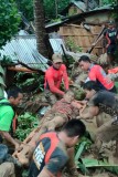 Search for survivors in Philippine villages hit by landslides