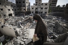 Gaza clears rubble, buries dead as truce with Israel holds